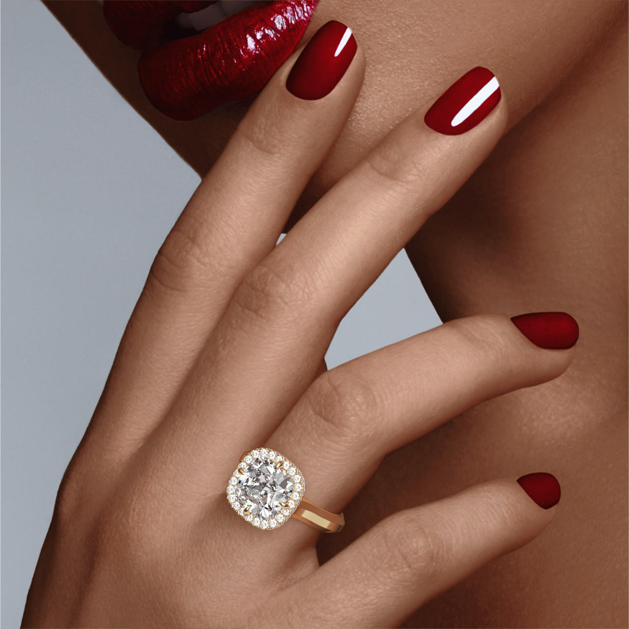 CUSHION CUT DIAMOND ENGAGEMENT RING WITH A WRAPPED HALO THREE PHASES SETTING IN 18K YELLOW GOLD