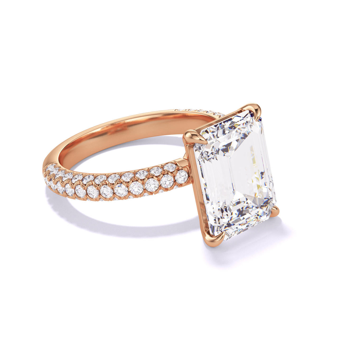 EMERALD CUT DIAMOND ENGAGEMENT RING WITH A CLASSIC 4 PRONG THREE PHASES TRIPLE PAVE SETTING IN 18K ROSE GOLD