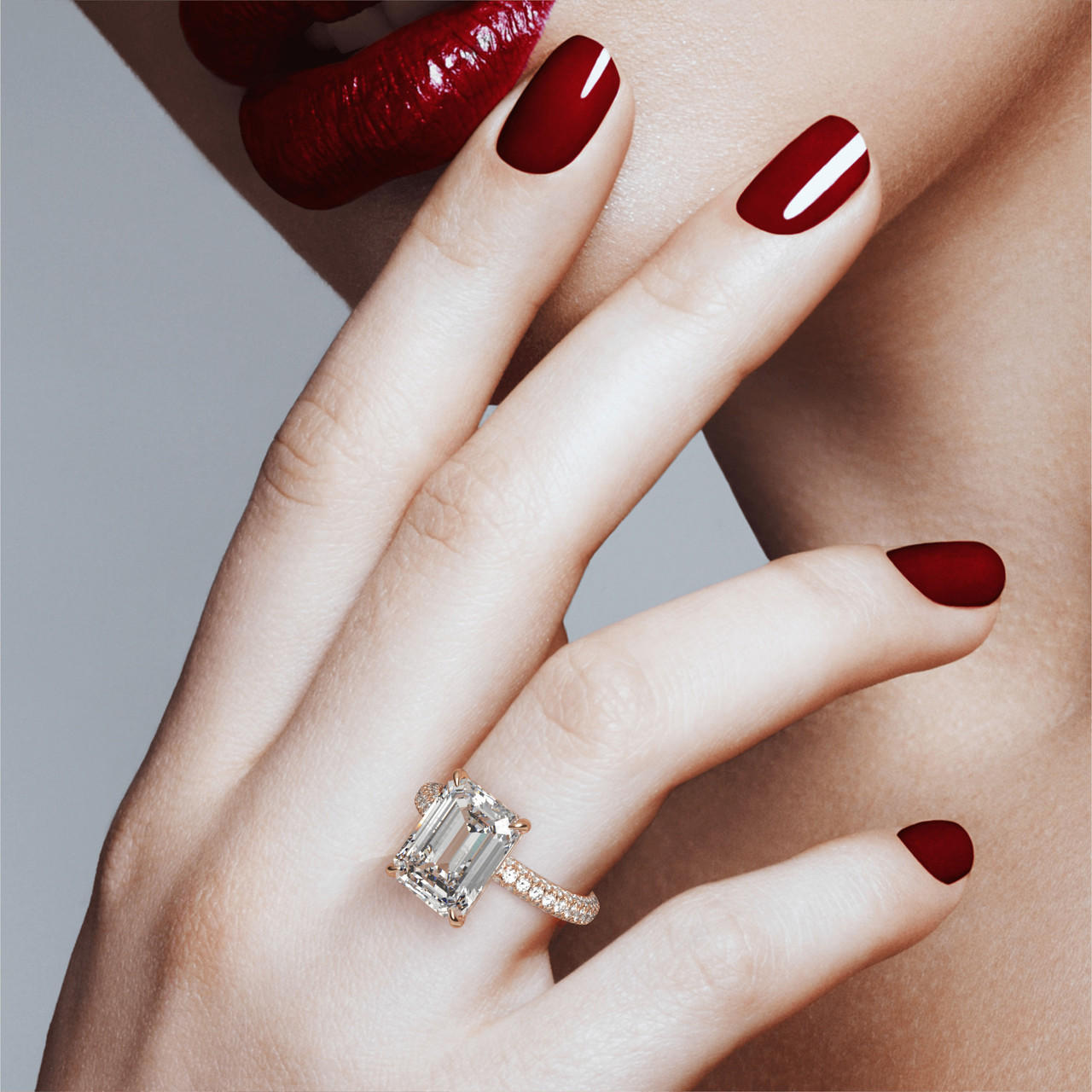 EMERALD CUT DIAMOND ENGAGEMENT RING WITH A CLASSIC 4 PRONG THREE PHASES TRIPLE PAVE SETTING IN 18K ROSE GOLD