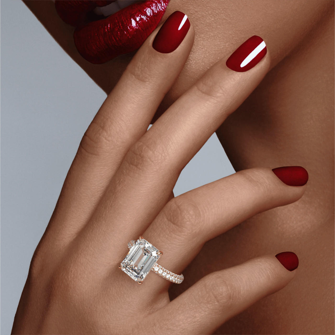 EMERALD CUT DIAMOND ENGAGEMENT RING WITH A CLASSIC 4 PRONG THREE PHASES TRIPLE PAVE SETTING IN 18K ROSE GOLD