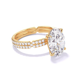 Oval cut diamond engagement ring with a classic 4 prong chance pave setting in 18k yellow gold