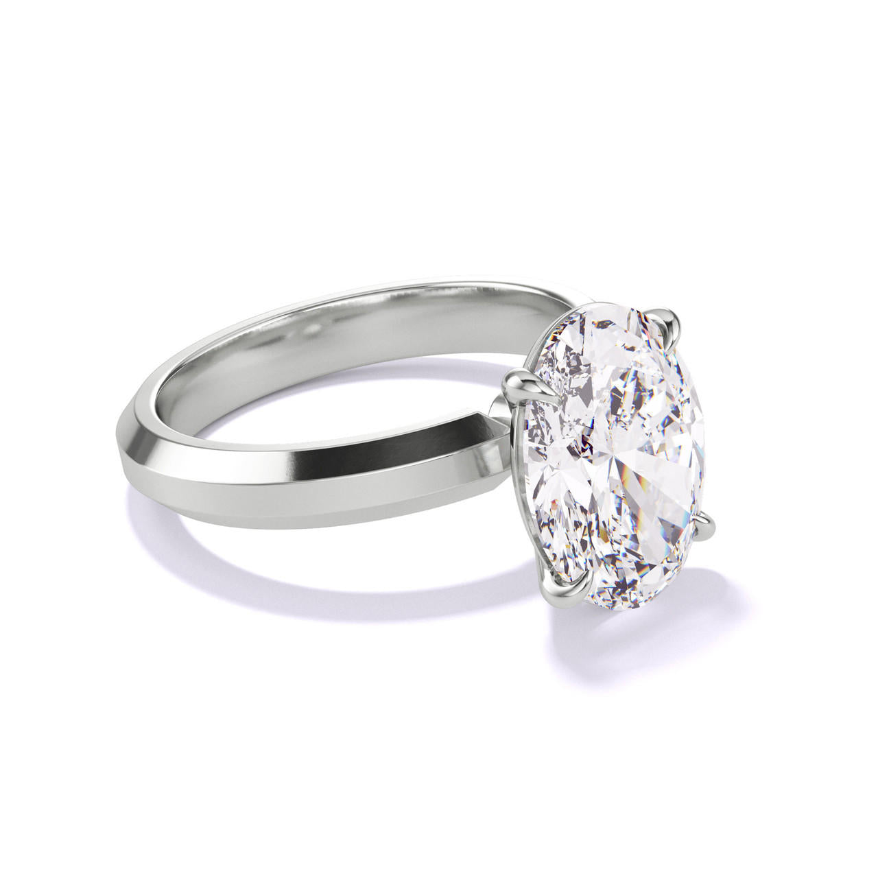 OVAL CUT DIAMOND ENGAGEMENT RING WITH A CLASSIC 4 PRONG THREE PHASES SETTING IN PLATINUM