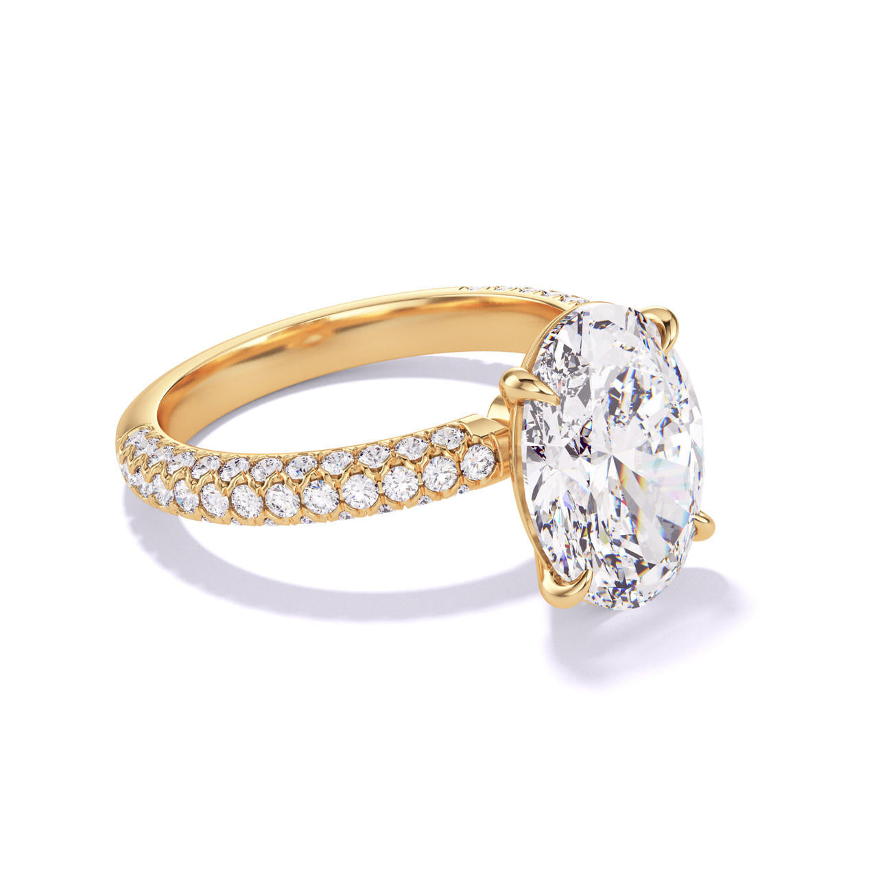 OVAL CUT DIAMOND ENGAGEMENT RING WITH A CLASSIC 4 PRONG THREE PHASES TRIPLE PAVE SETTING IN 18K YELLOW GOLD