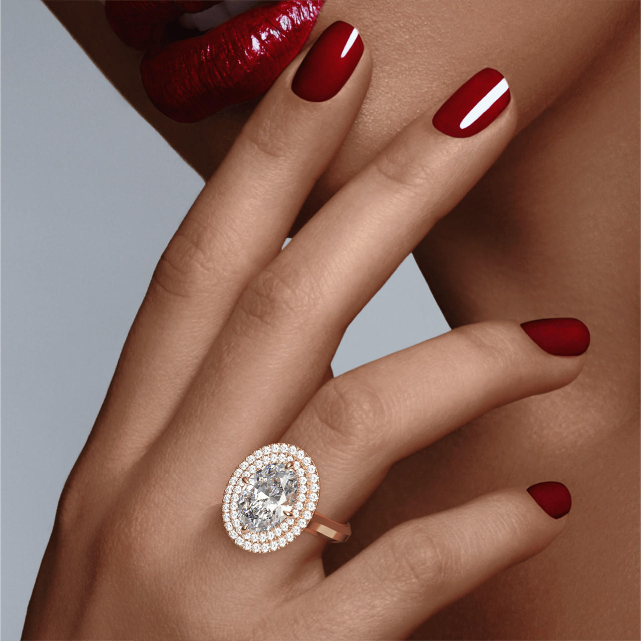 OVAL CUT DIAMOND ENGAGEMENT RING WITH A DOUBLE HALO THREE PHASES SETTING IN 18K ROSE GOLD