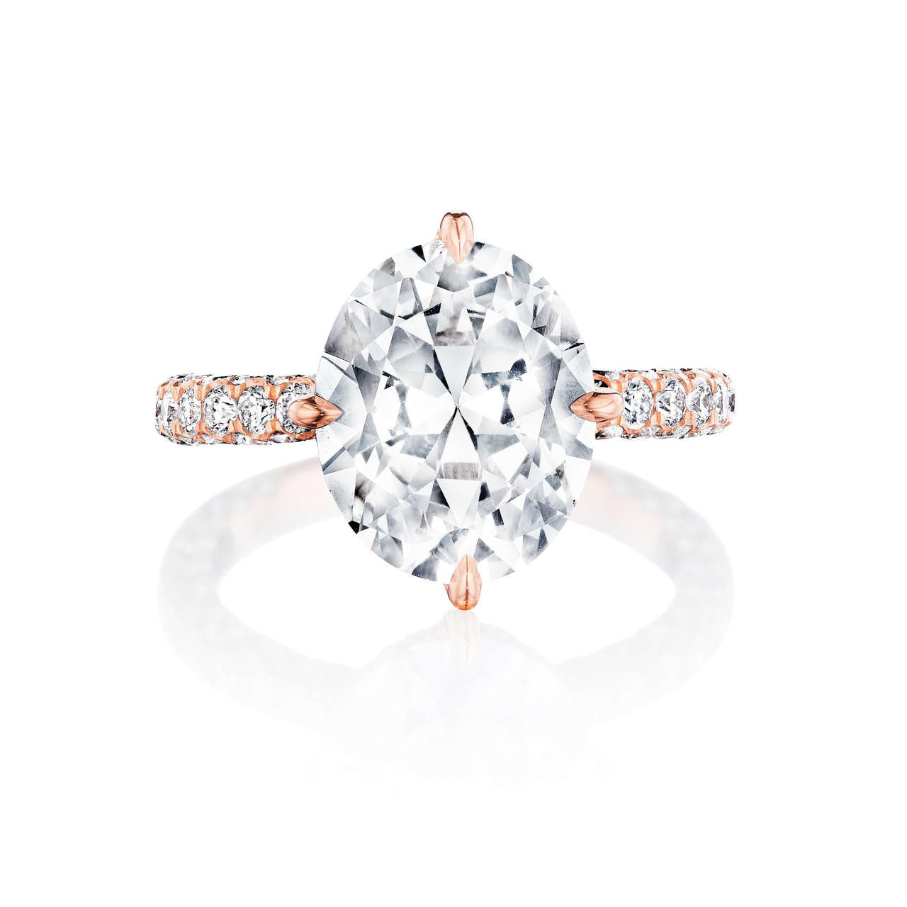 oval solitaire engagement ring in rose gold on a pave band