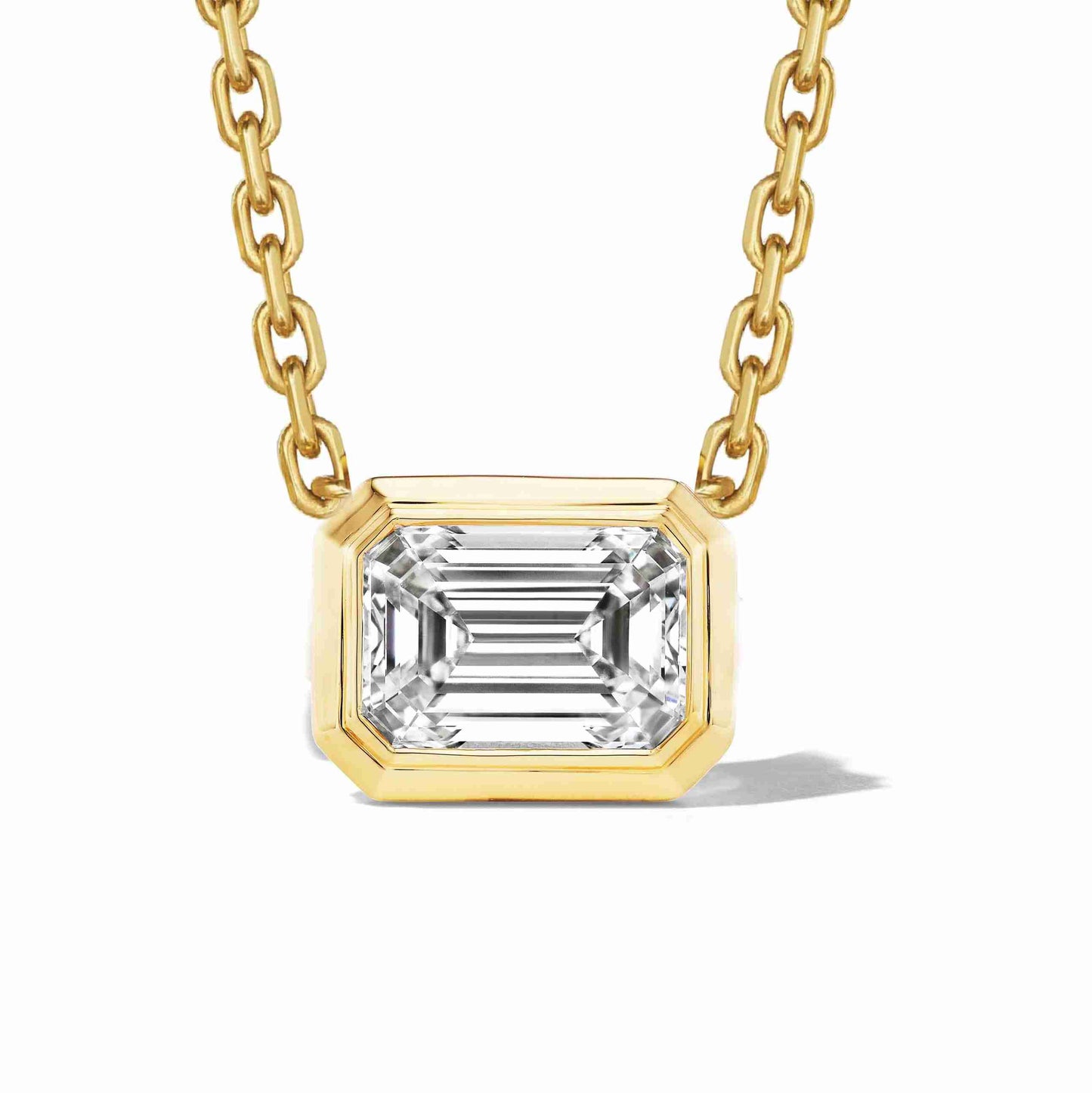 east-west-emerald-cut-diamond-bezel-set-pendant-necklace
