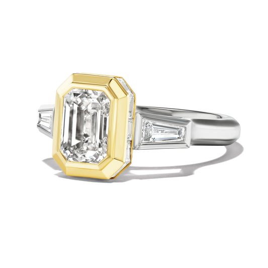 SHIELD BEZEL SET EMERALD CUT ENGAGEMENT RING WITH TAPERED BAGUETTES