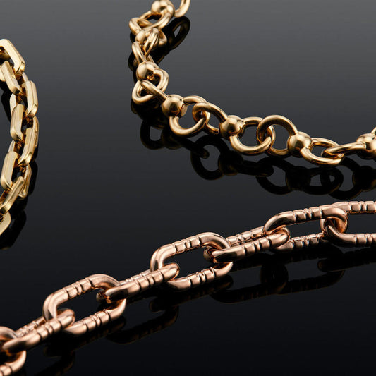 twisted infinity ball and chain necklace in 18 karat gold; gold ball chain necklace
