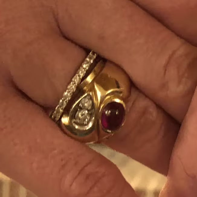 Lindsay's original heirloom ring paired with an eternity band