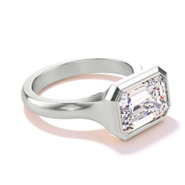 shield bezel set east west emerald cut engagement ring in platinum