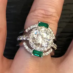 BESPOKE ROUND DIAMOND ENGAGEMENT RING WITH EMERALD BANDS