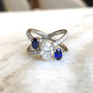 BESPOKE OVAL DIAMOND AND SAPPHIRE THREE STONE RING