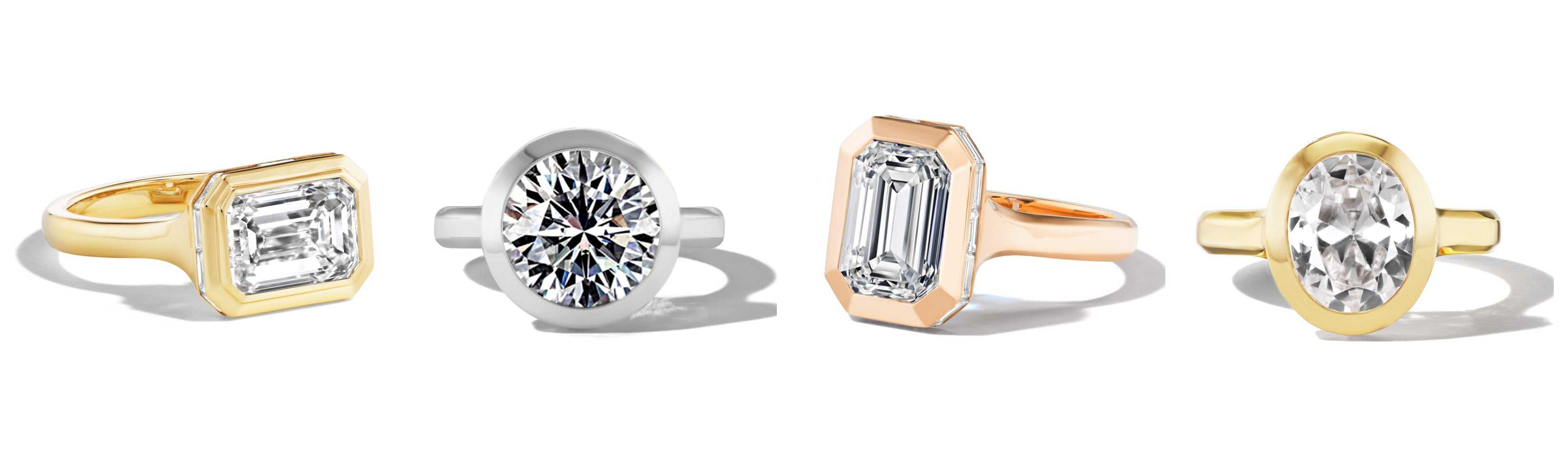 Set of four rings: emerald-cut yellow diamond, platinum round diamond, rose gold emerald-cut ring, and oval yellow gold ring.