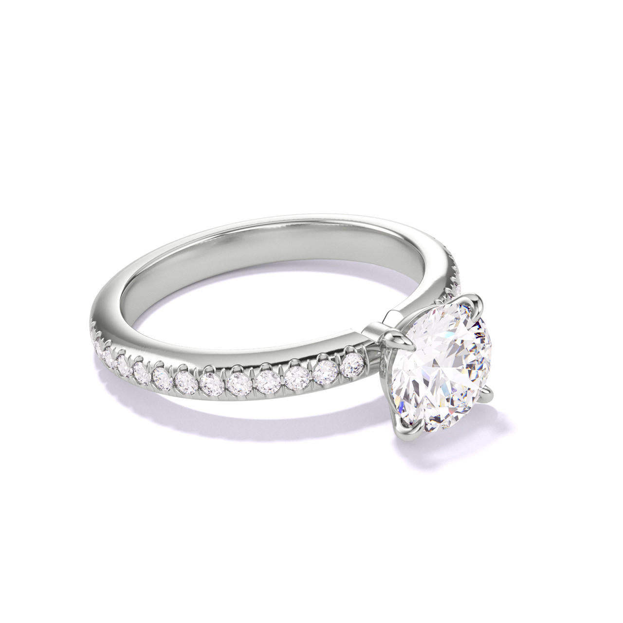 Classic Round Engagement Ring with a four prong setting on a pave band in platinum 