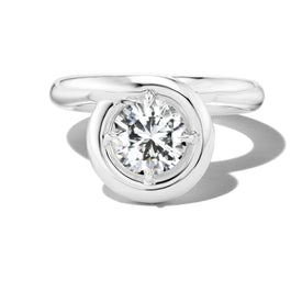 Modern Endless Loop platinum engagement ring design showcasing a round cut center diamond.