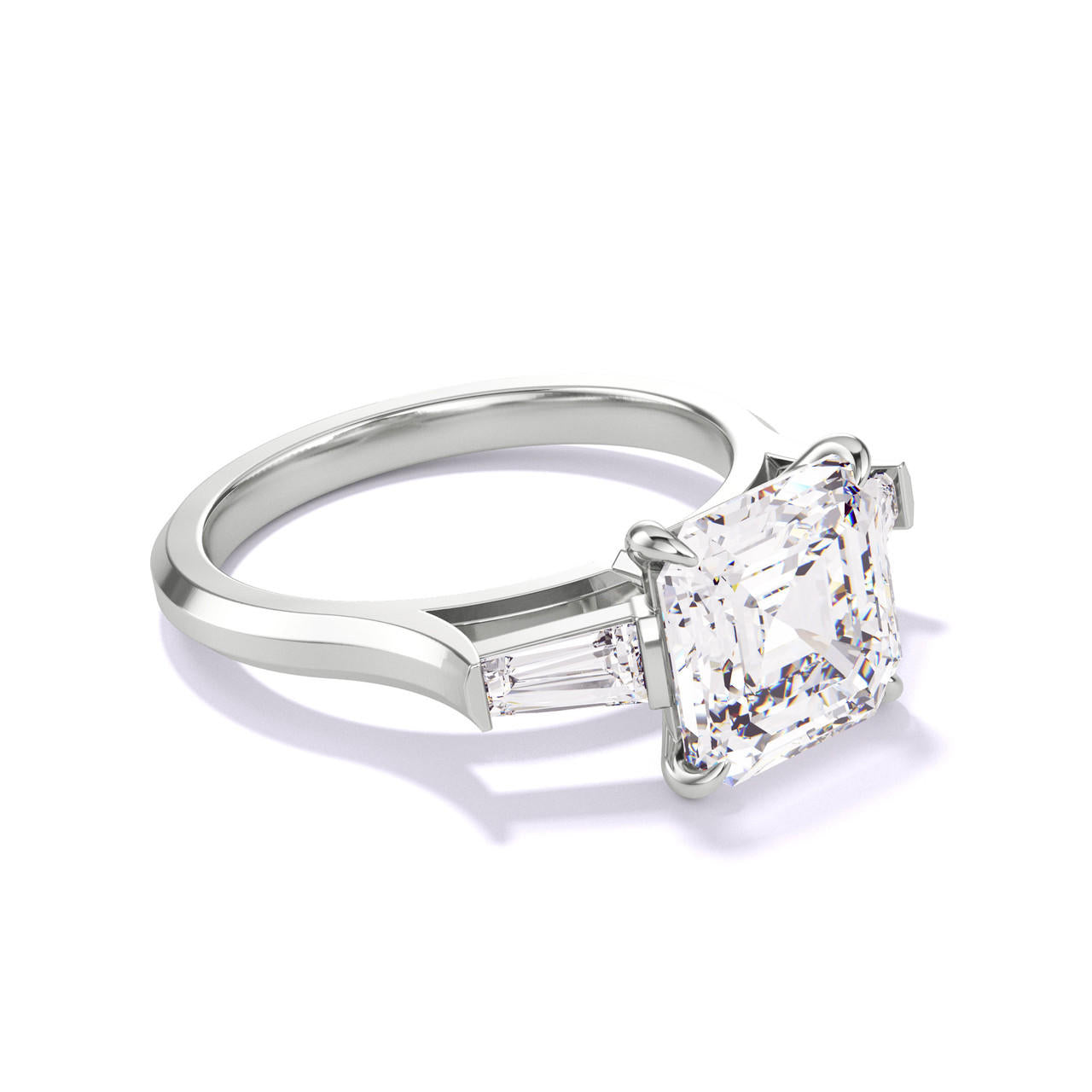 ASSCHER CUT DIAMOND ENGAGEMENT RING WITH A BAGUETTE FLANK THREE PHASES SLIM SETTING IN PLATINUM