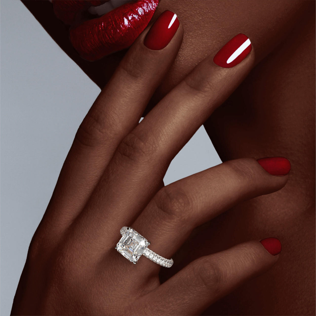 ASSCHER CUT DIAMOND ENGAGEMENT RING WITH A CLASSIC 4 PRONG THREE PHASES TRIPLE PAVE SETTING IN PLATINUM