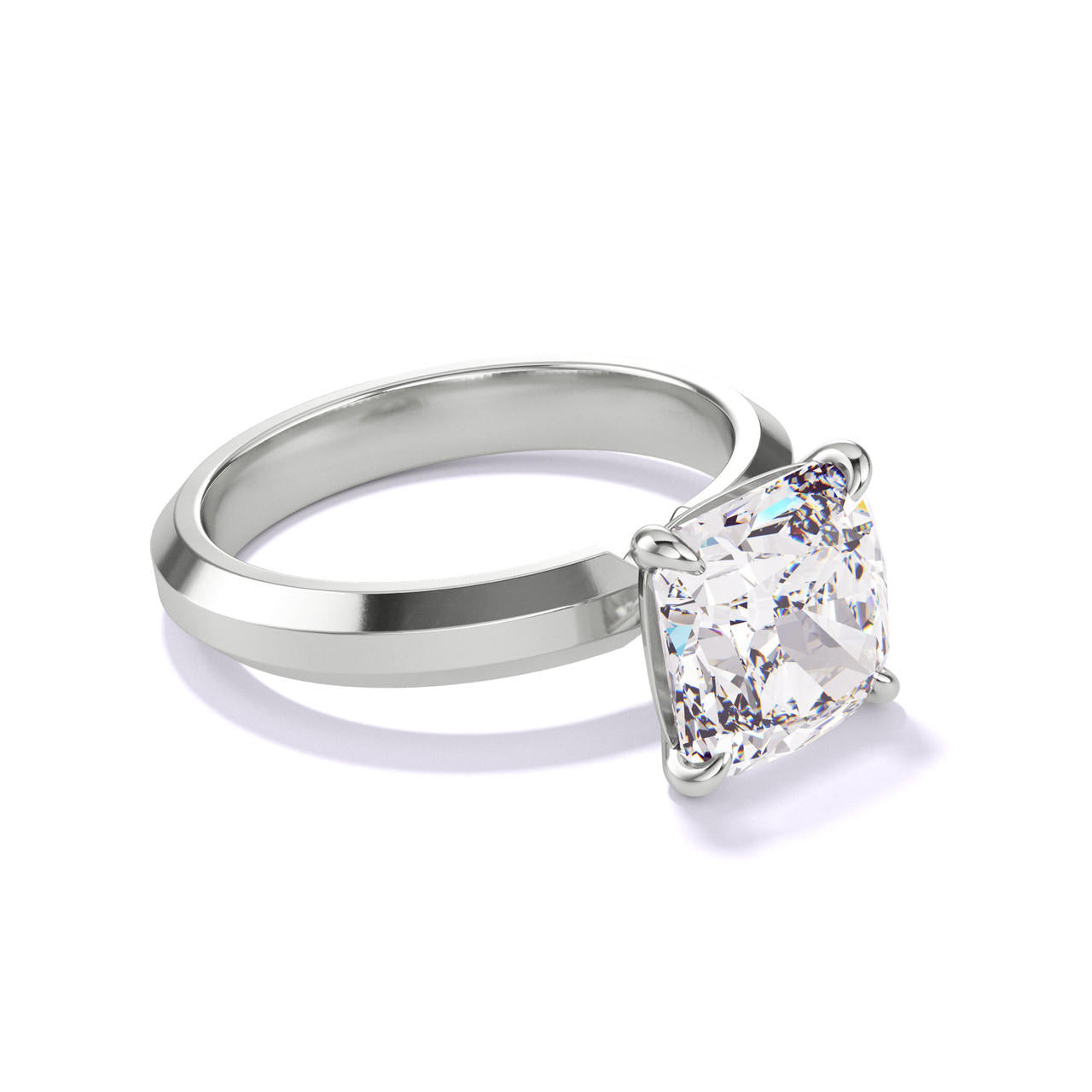 CUSHION CUT DIAMOND ENGAGEMENT RING WITH A CLASSIC 4 PRONG THREE PHASES SETTING IN PLATINUM