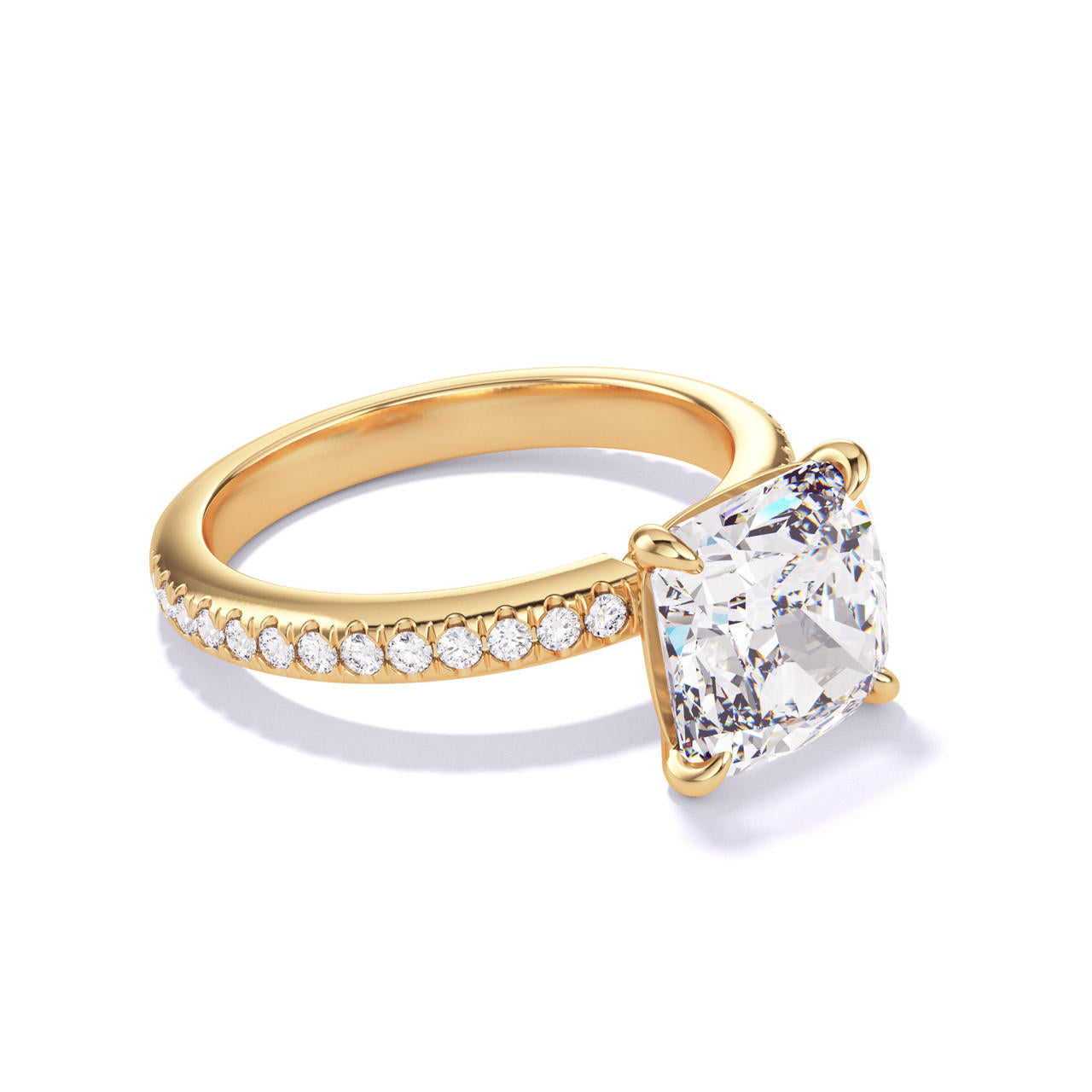 CUSHION CUT DIAMOND ENGAGEMENT RING WITH A CLASSIC 4 PRONG THREE PHASES PAVE SETTING IN 18K YELLOW GOLD