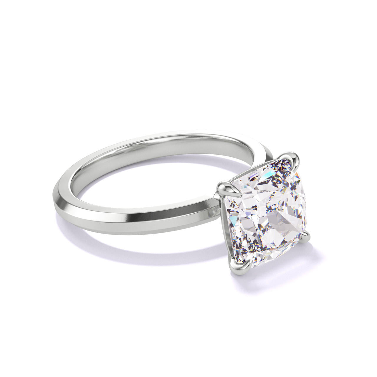 CUSHION CUT DIAMOND ENGAGEMENT RING WITH A CLASSIC 4 PRONG THREE PHASES SLIM SETTING IN PLATINUM