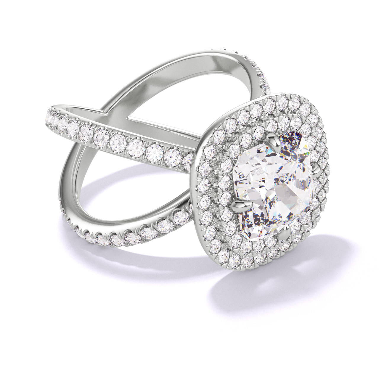 CUSHION CUT DIAMOND ENGAGEMENT RING WITH A DOUBLE HALO AXIS PAVE SETTING IN PLATINUM