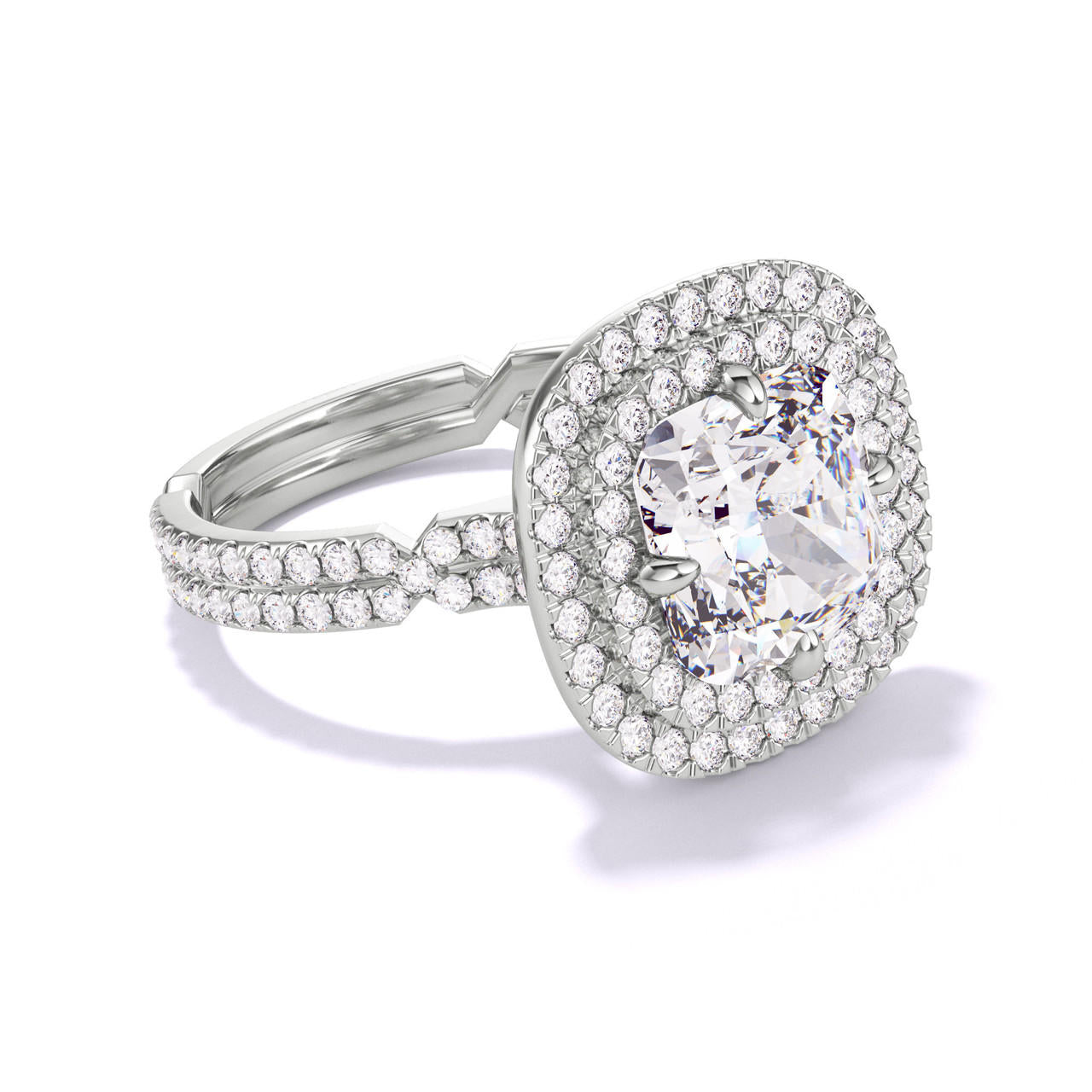 CUSHION CUT DIAMOND ENGAGEMENT RING WITH A DOUBLE HALO CHANCE PAVE SETTING IN PLATINUM