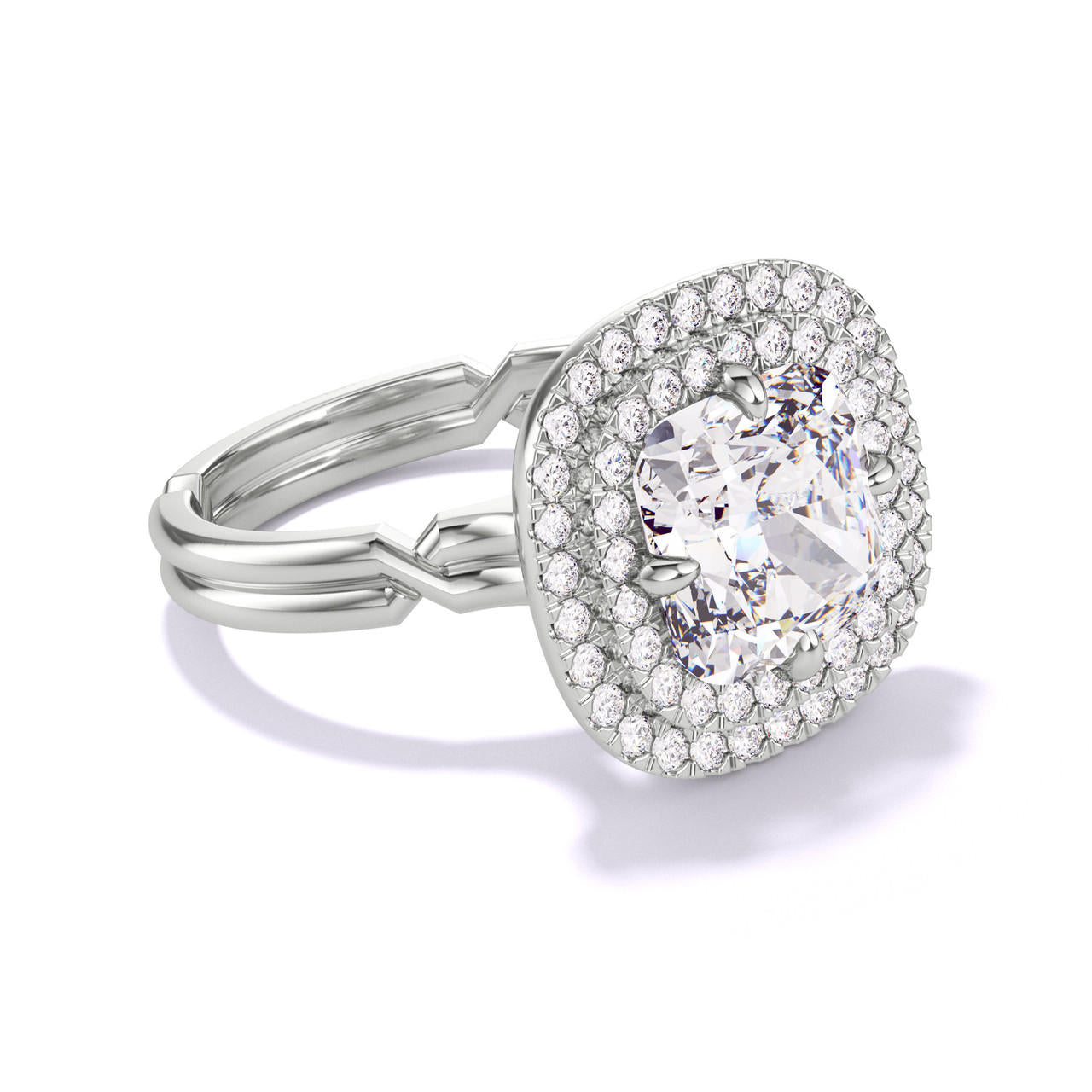 CUSHION CUT DIAMOND ENGAGEMENT RING WITH A DOUBLE HALO CHANCE SETTING IN PLATINUM