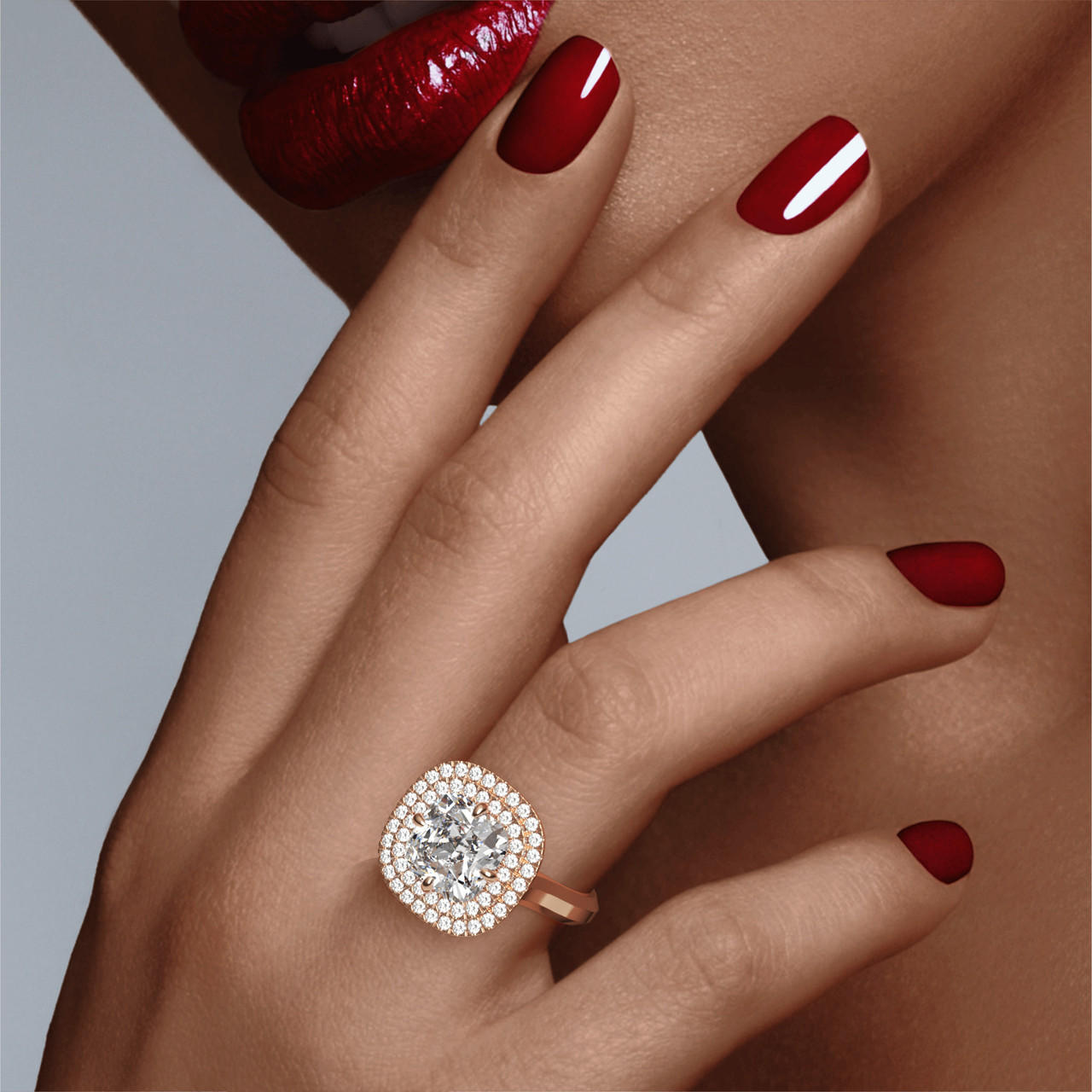 Oval stone with double halo and slim three phases band in rose gold on hand