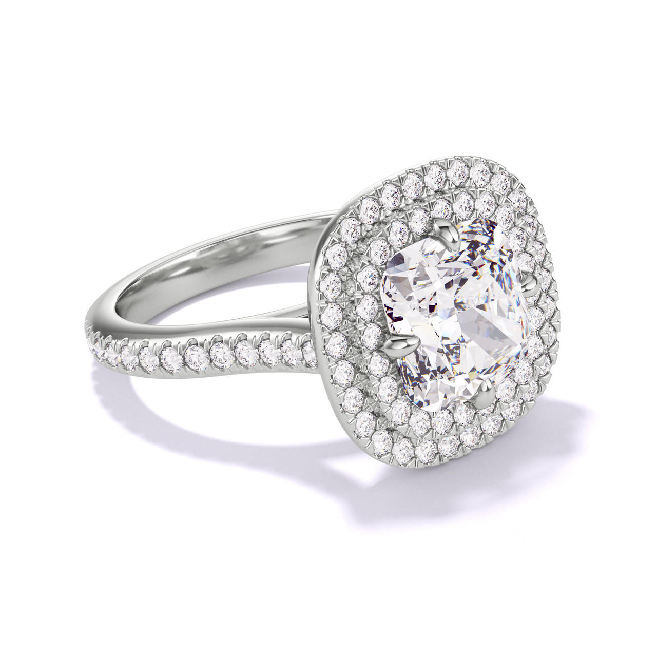 CUSHION CUT DIAMOND ENGAGEMENT RING WITH A DOUBLE HALO THREE PHASES PAVE SETTING IN PLATINUM