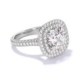An angled shot of the Cushion Cut Diamond Engagement Ring with a Double Halo Three Phases Triple Pave Setting in Platinum. 
