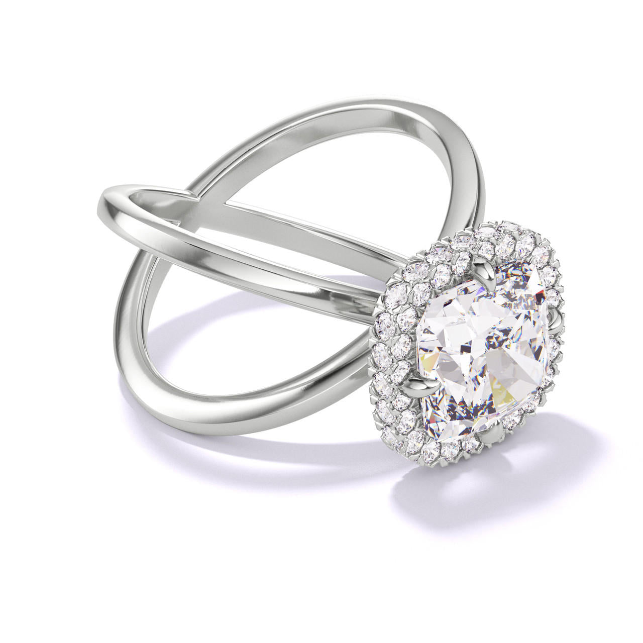 CUSHION CUT DIAMOND ENGAGEMENT RING WITH A WRAPPED HALO AXIS SETTING IN PLATINUM