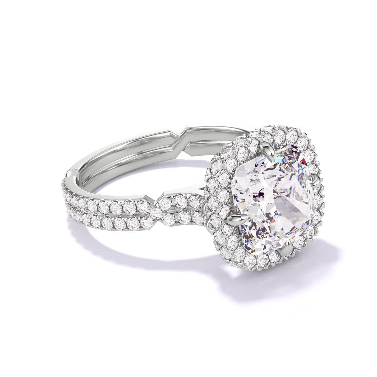 CUSHION CUT DIAMOND ENGAGEMENT RING WITH A WRAPPED HALO CHANCE PAVE SETTING IN PLATINUM