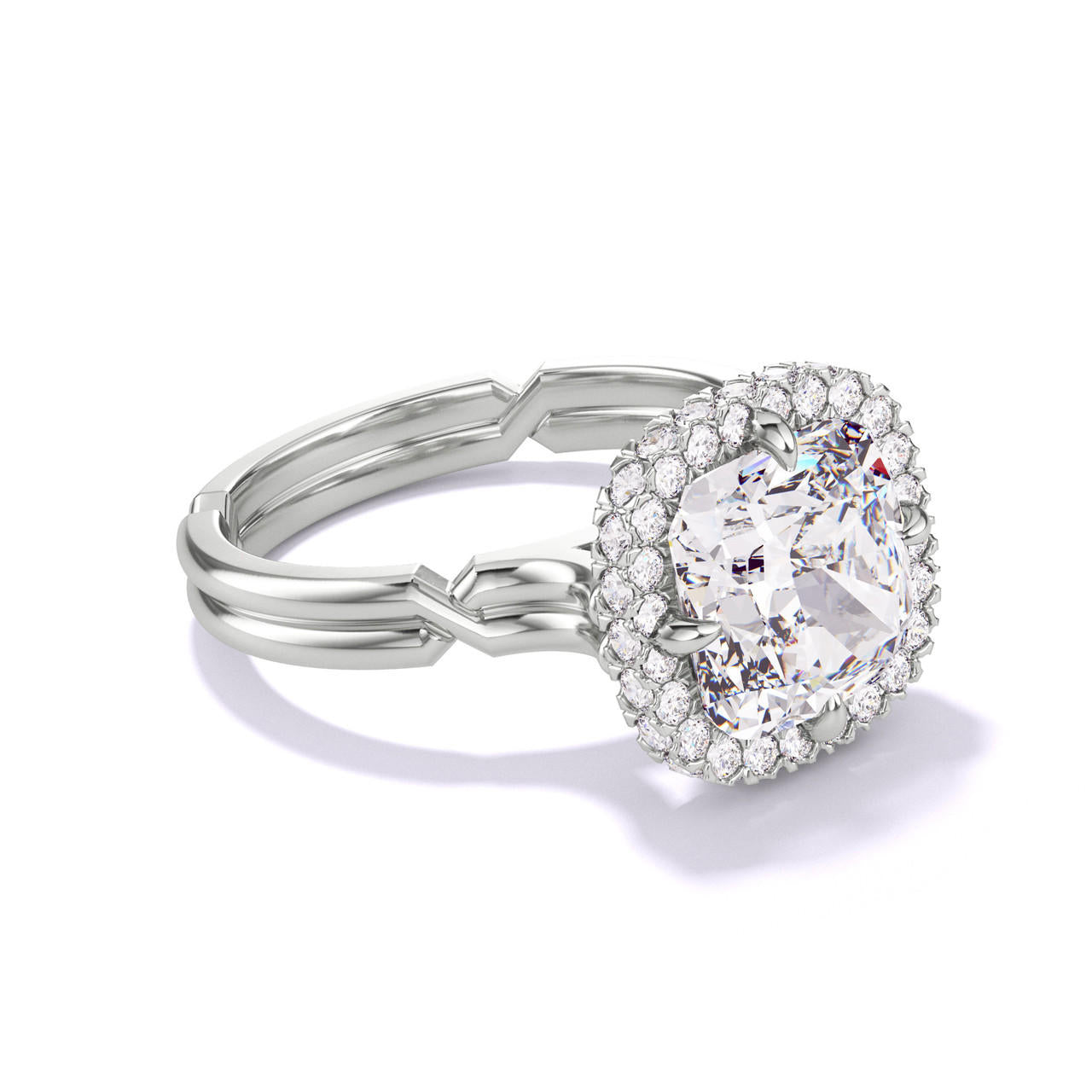 CUSHION CUT DIAMOND ENGAGEMENT RING WITH A WRAPPED HALO CHANCE SETTING IN PLATINUM