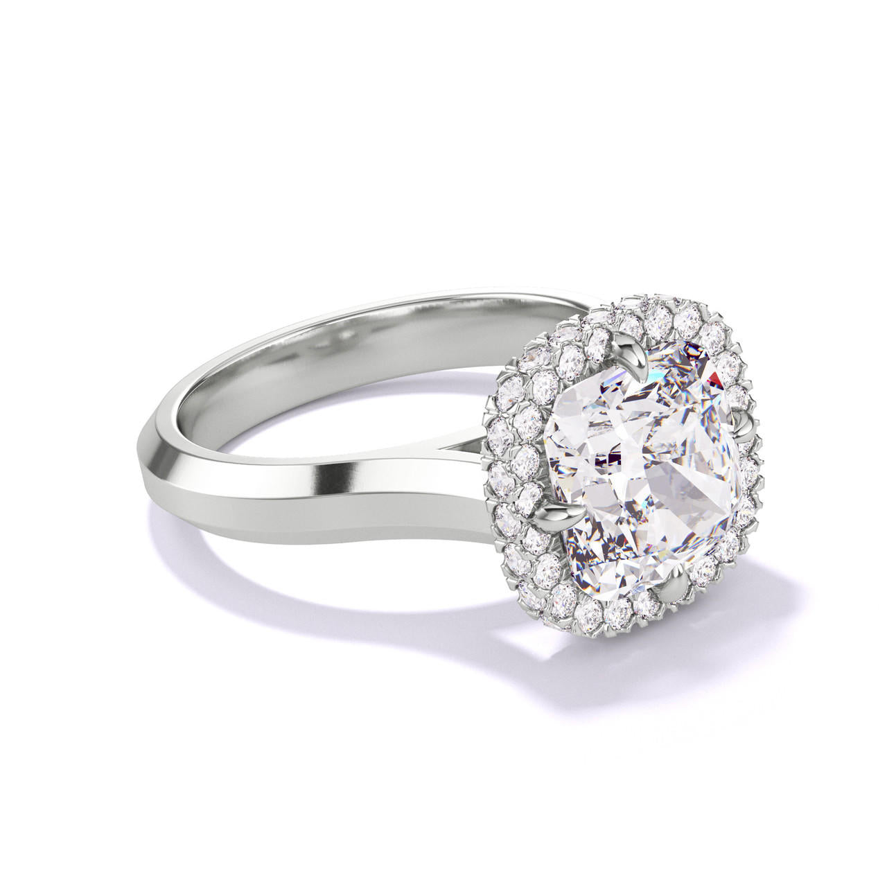 CUSHION CUT DIAMOND ENGAGEMENT RING WITH A WRAPPED HALO THREE PHASES SETTING IN PLATINUM