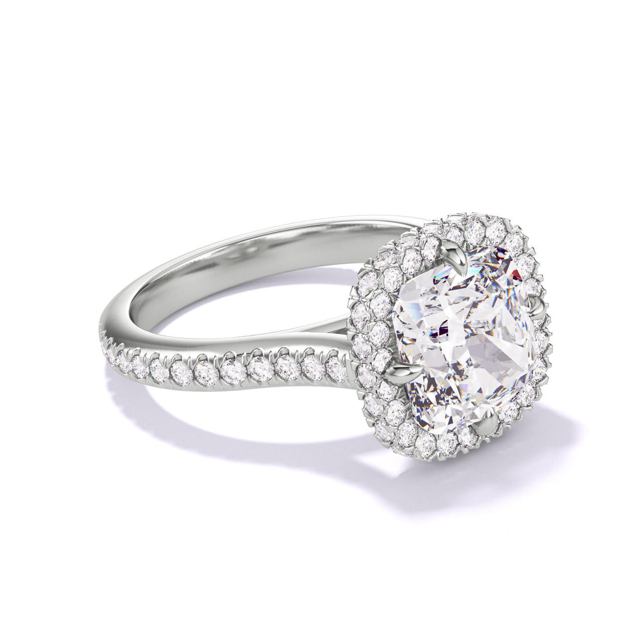 CUSHION CUT DIAMOND ENGAGEMENT RING WITH A WRAPPED HALO THREE PHASES PAVE SETTING IN PLATINUM