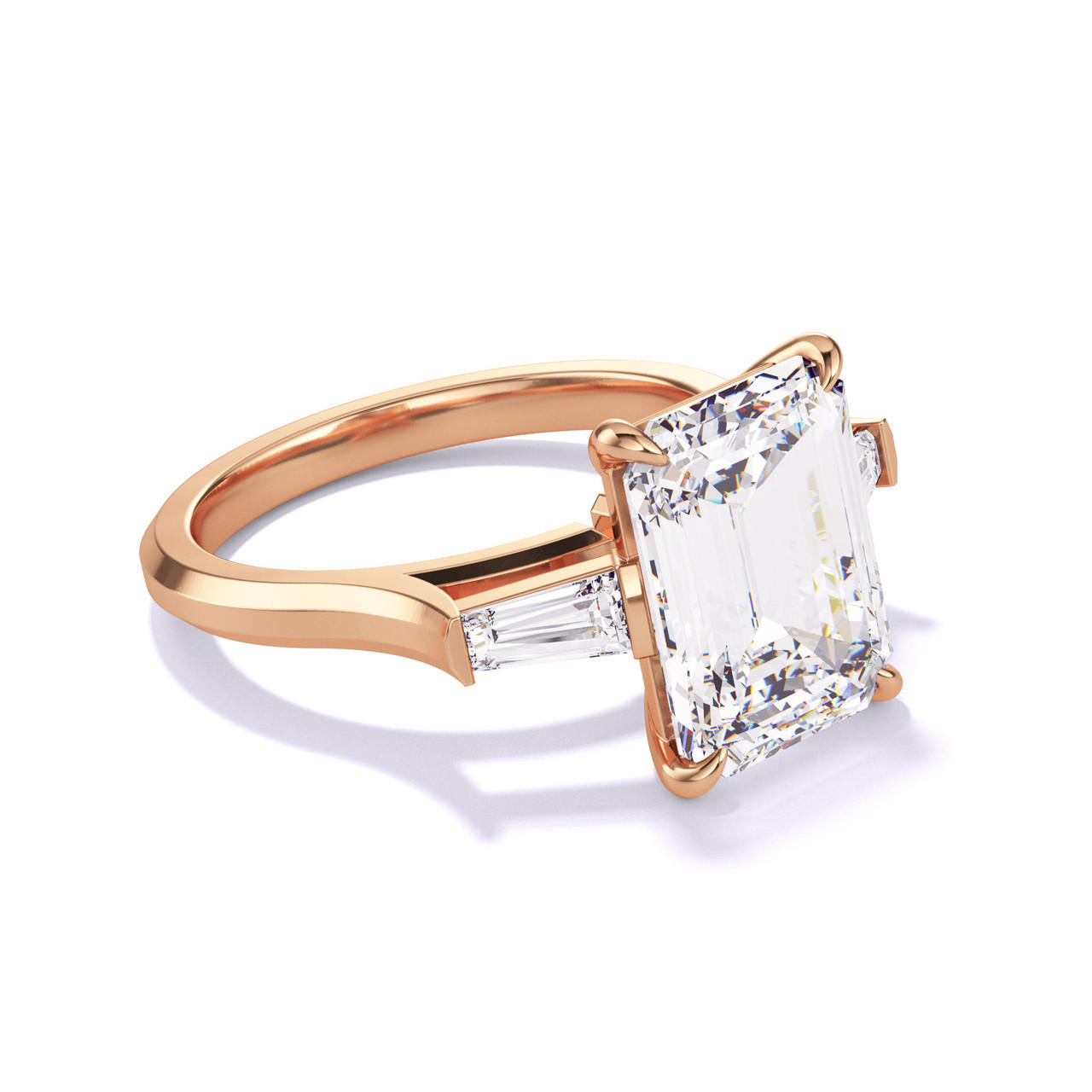 EMERALD CUT DIAMOND ENGAGEMENT RING WITH A BAGUETTE FLANK THREE PHASES SLIM SETTING IN 18K ROSE GOLD