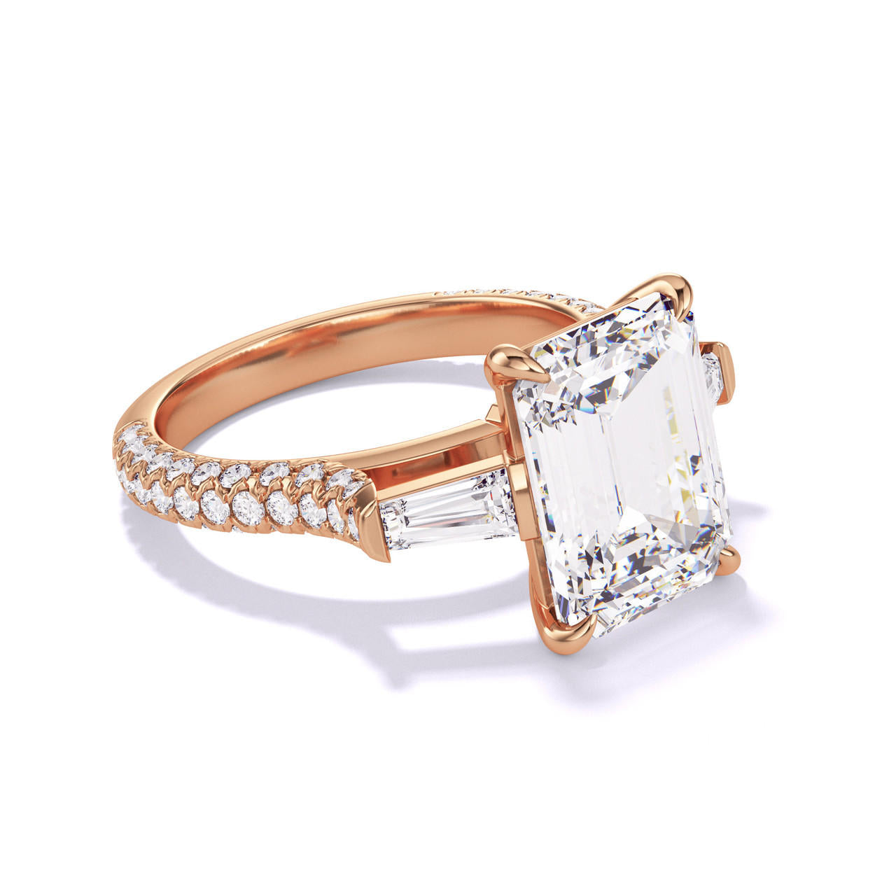 emerald cut diamond engagement ring with a baguette flank three phases triple pave setting in 18k rose gold