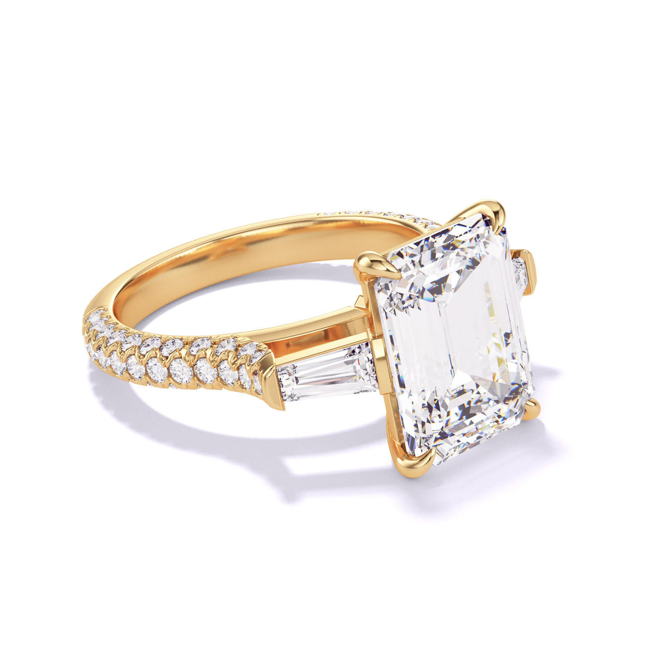 emerald cut diamond engagement ring with a baguette flank three phases triple pave setting in 18k yellow gold