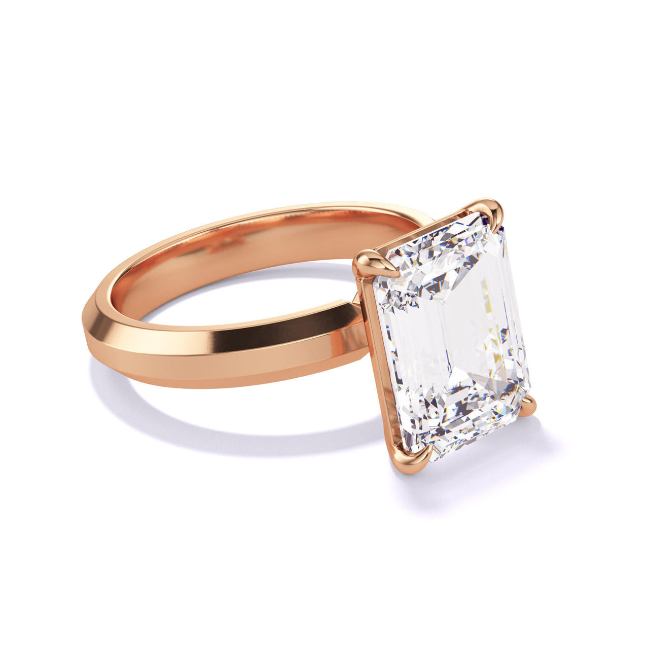 EMERALD CUT DIAMOND ENGAGEMENT RING WITH A CLASSIC 4 PRONG THREE PHASES SETTING IN 18K ROSE GOLD