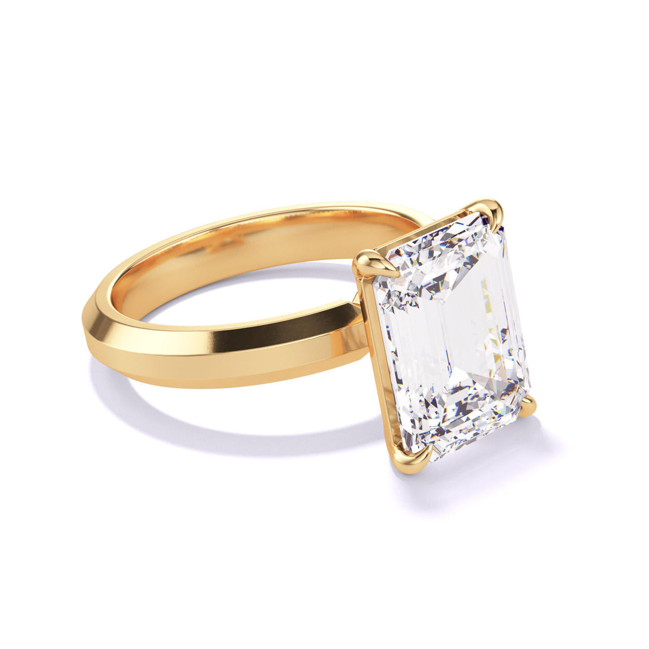 EMERALD CUT DIAMOND ENGAGEMENT RING WITH A CLASSIC 4 PRONG THREE PHASES SETTING IN 18K YELLOW GOLD