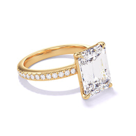 EMERALD CUT DIAMOND ENGAGEMENT RING WITH A CLASSIC 4 PRONG THREE PHASES PAVE SETTING IN 18K YELLOW GOLD