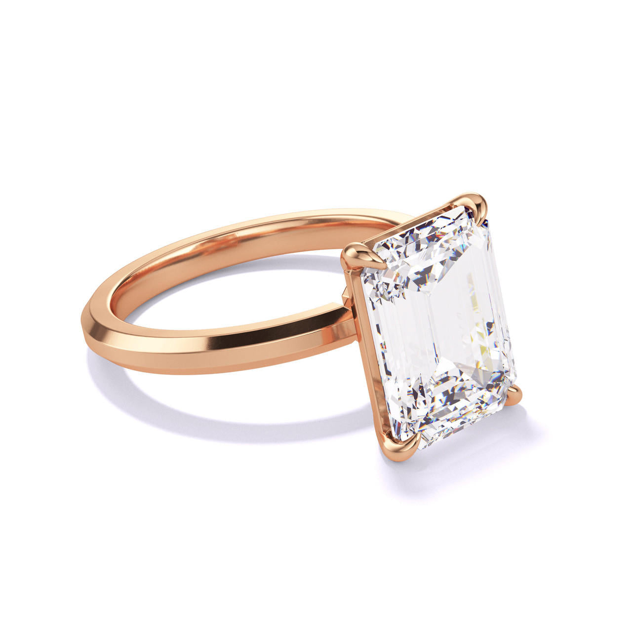 EMERALD CUT DIAMOND ENGAGEMENT RING WITH A CLASSIC 4 PRONG THREE PHASES SLIM SETTING IN 18K ROSE GOLD