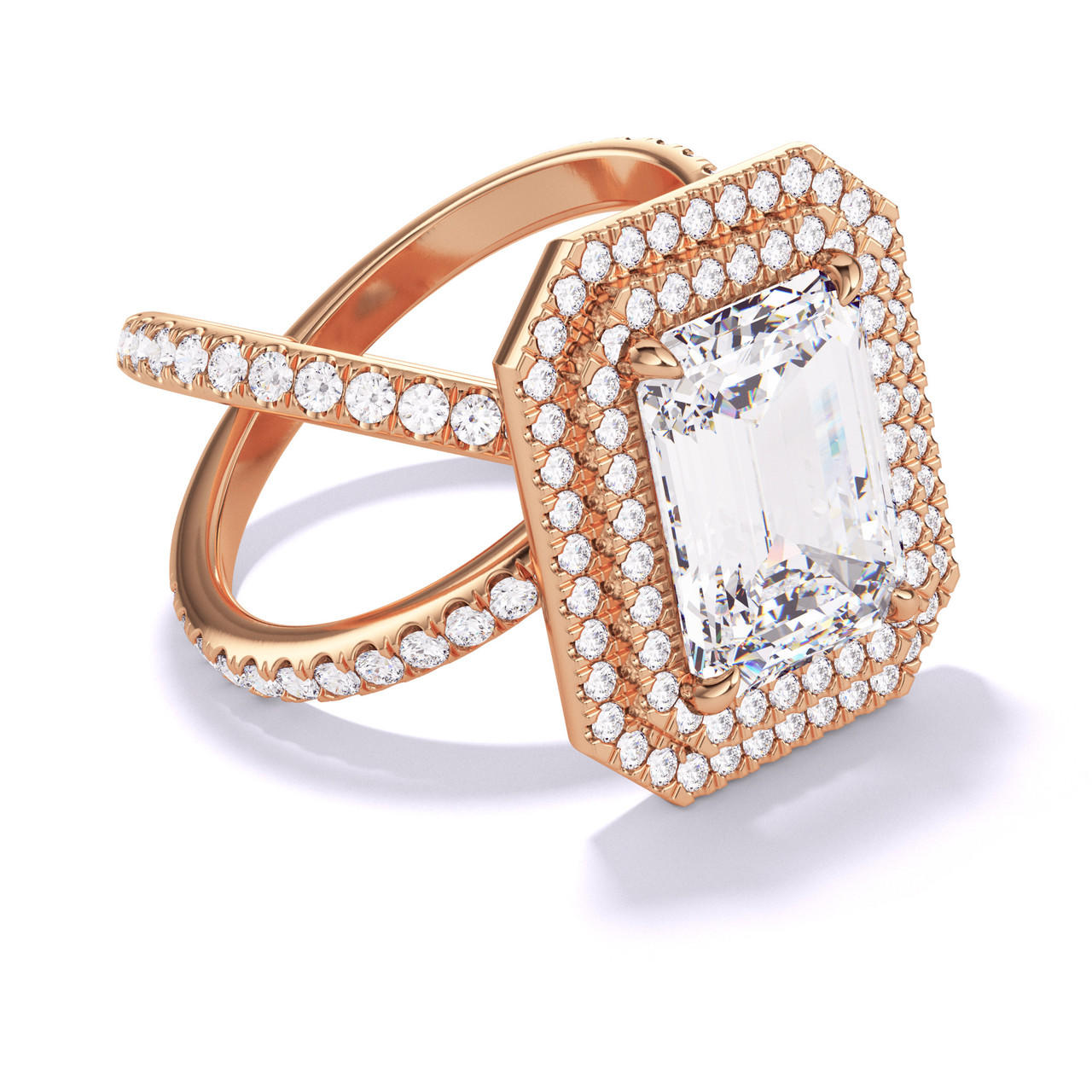 EMERALD CUT DIAMOND ENGAGEMENT RING WITH A DOUBLE HALO AXIS PAVE SETTING IN 18K ROSE GOLD