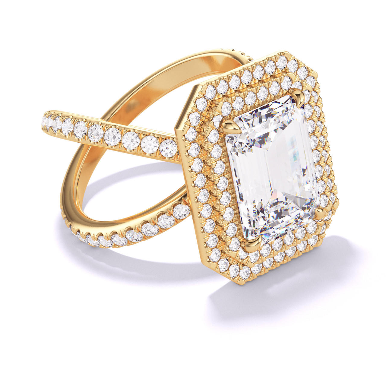 EMERALD CUT DIAMOND ENGAGEMENT RING WITH A DOUBLE HALO AXIS PAVE SETTING IN 18K YELLOW GOLD