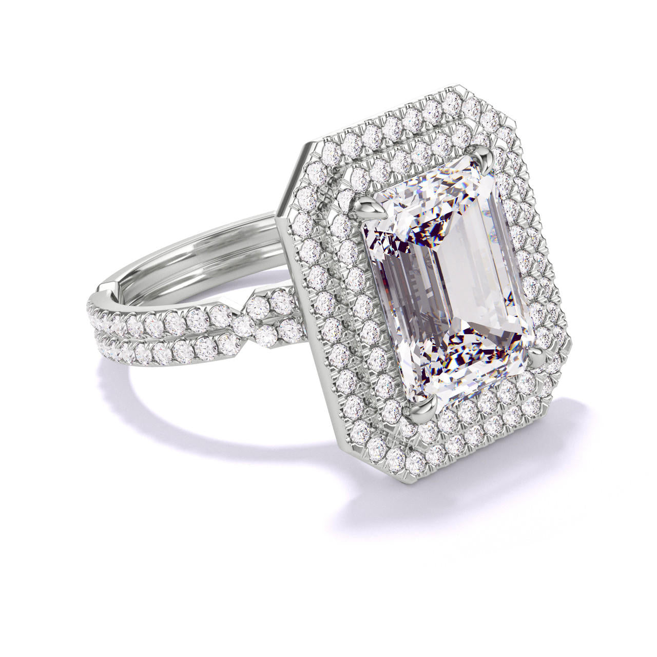 EMERALD CUT DIAMOND ENGAGEMENT RING WITH A DOUBLE HALO CHANCE PAVE SETTING IN PLATINUM