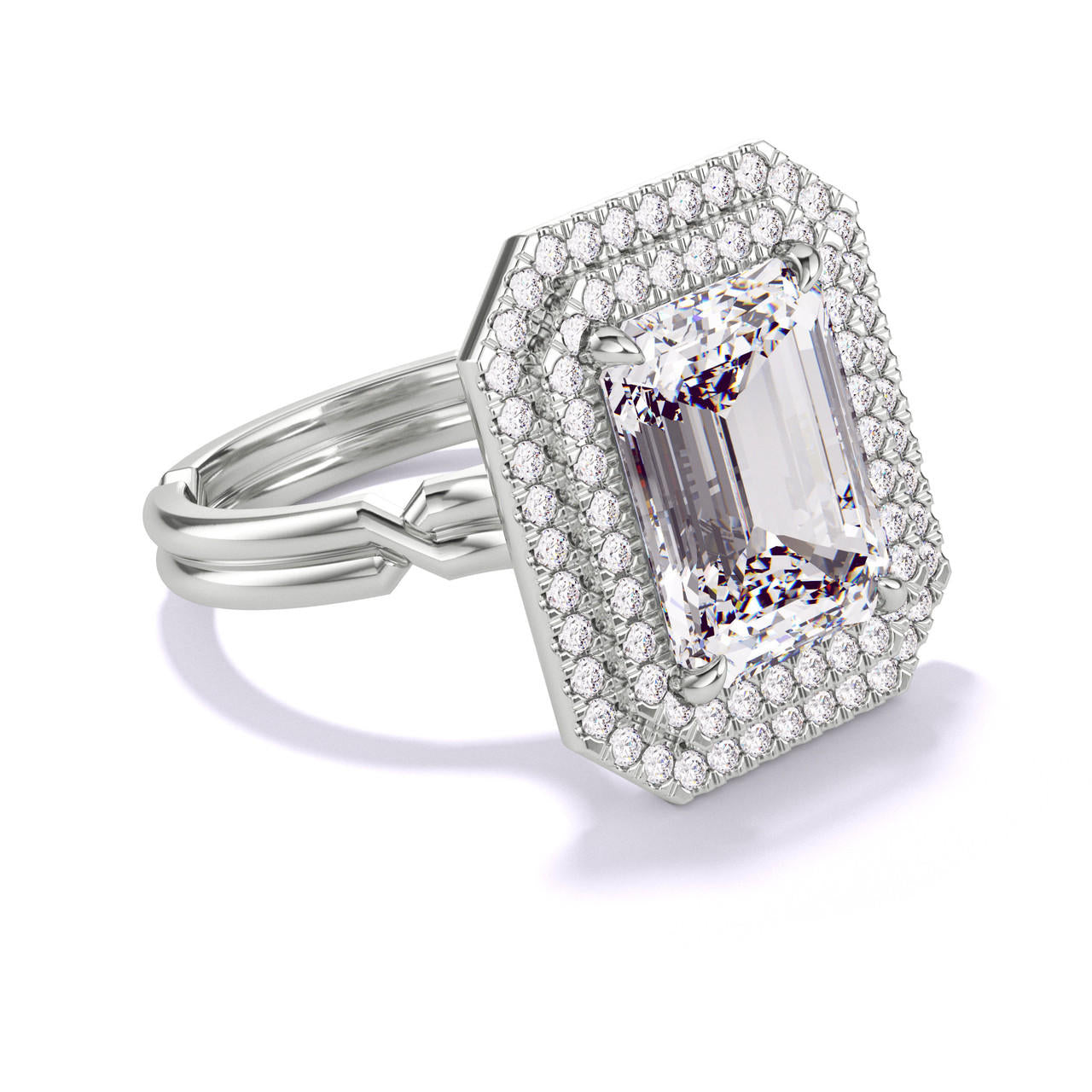 EMERALD CUT DIAMOND ENGAGEMENT RING WITH A DOUBLE HALO CHANCE SETTING IN PLATINUM