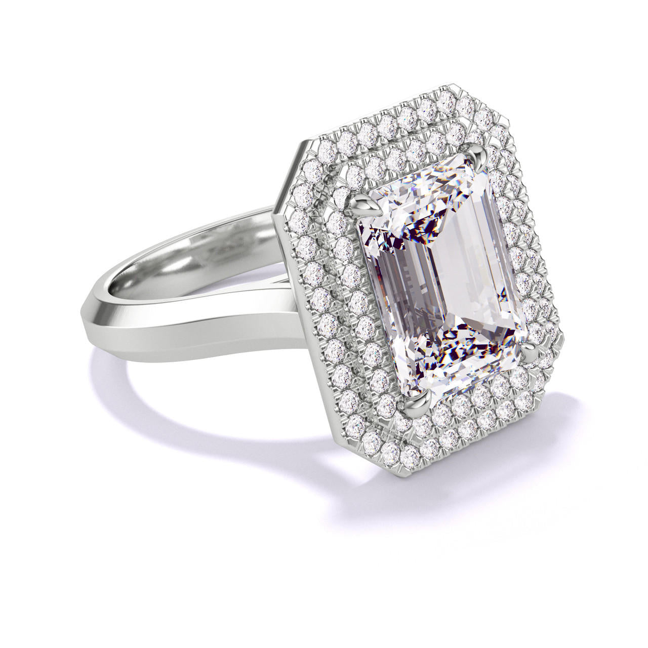 EMERALD CUT DIAMOND ENGAGEMENT RING WITH A DOUBLE HALO THREE PHASES SETTING IN PLATINUM