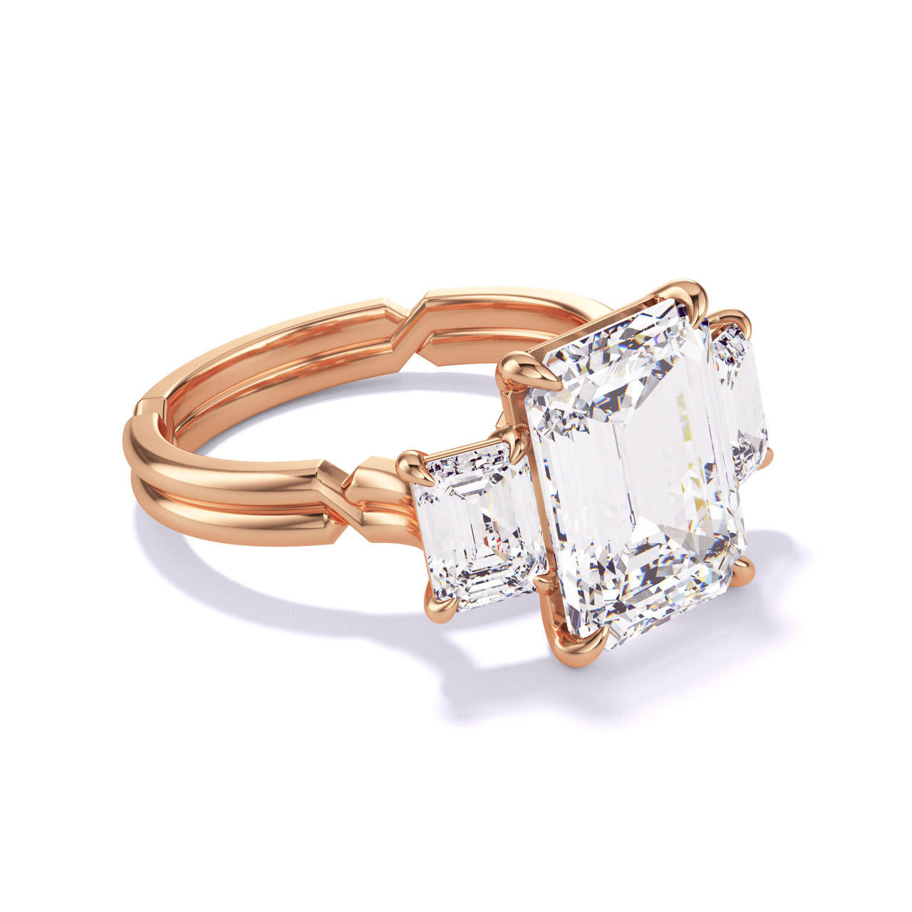 EMERALD CUT DIAMOND ENGAGEMENT RING WITH A THREE STONE CHANCE SETTING IN 18K ROSE GOLD