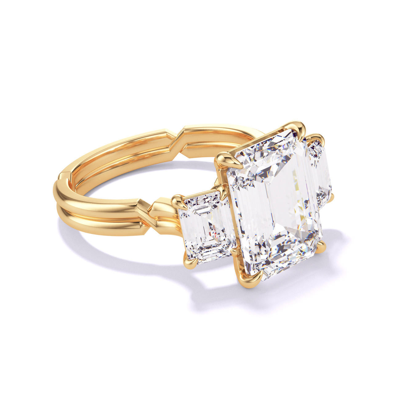 EMERALD CUT DIAMOND ENGAGEMENT RING WITH A THREE STONE CHANCE SETTING IN 18K YELLOW GOLD