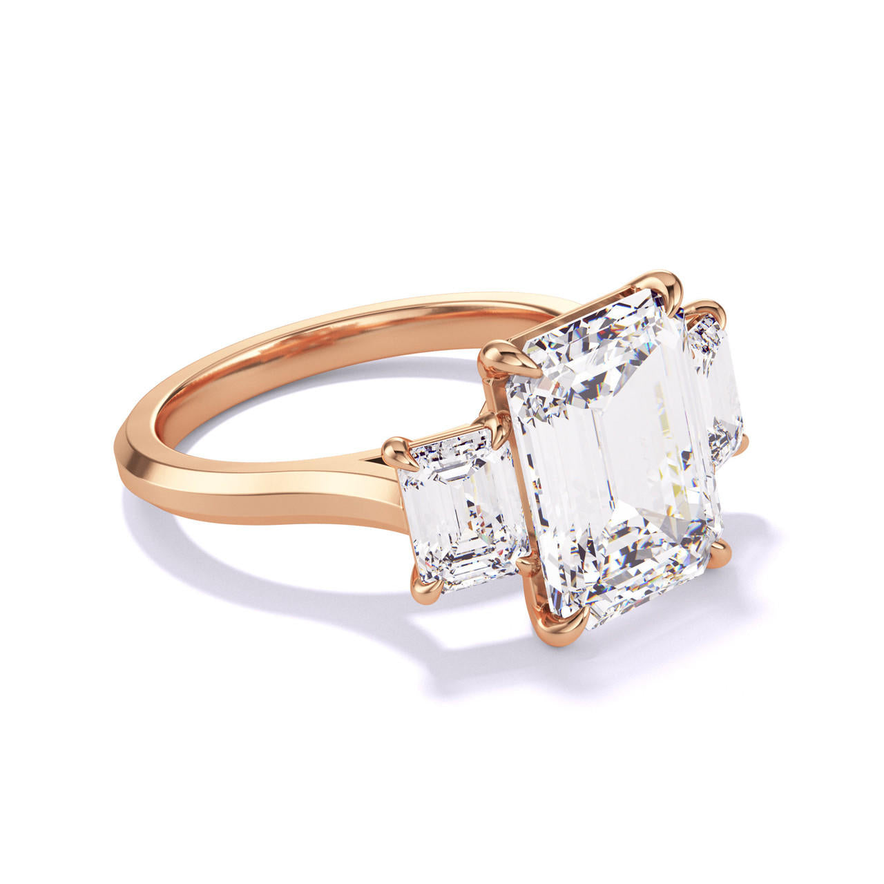 EMERALD CUT DIAMOND ENGAGEMENT RING WITH A THREE STONE THREE PHASES SLIM SETTING IN 18K ROSE GOLD